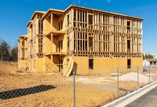 construction zone secured with a temporary fence, marked with warning signs in Cutler Bay